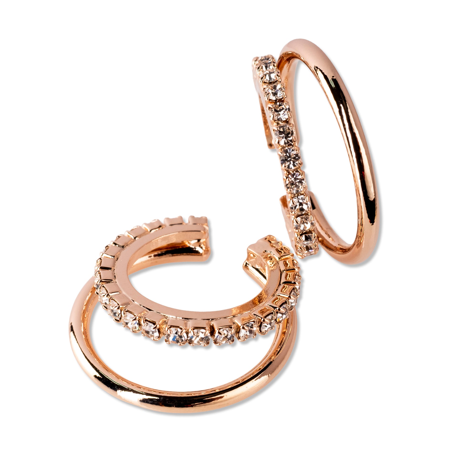 Rose gold hoop earrings with embedded stones on a white background